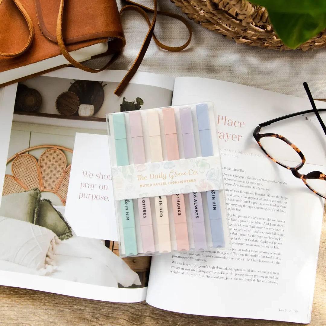 Pastel Bible highlighters on a book, featuring soft shades for serene note-taking and scripture emphasis.