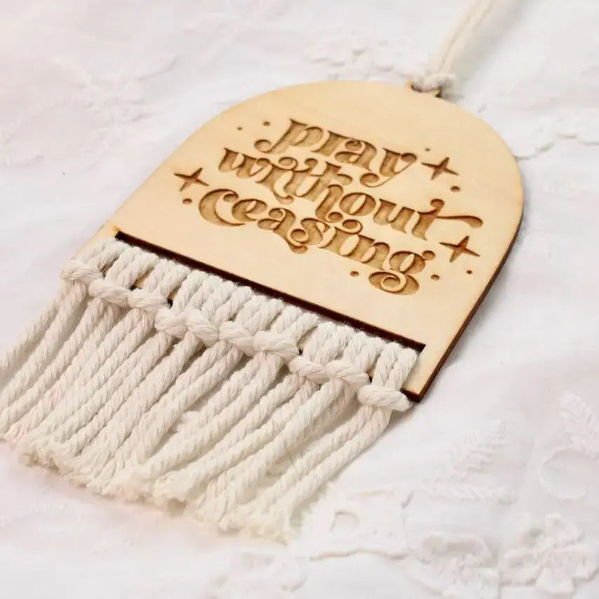 Pray Without Ceasing rearview mirror charm with elegant engraving and tassel detail.