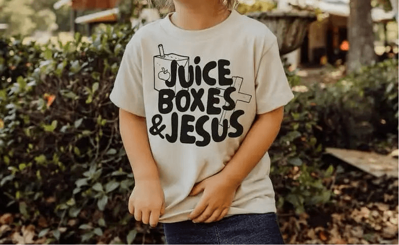Youth tee featuring the phrase 'Juice Boxes & Jesus' for kids' faith-inspired fashion.