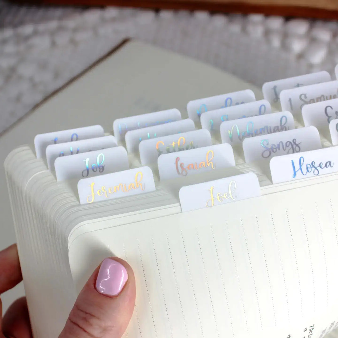 Stylish holographic Bible tabs displayed in a Bible for easy navigation and elegant organization.