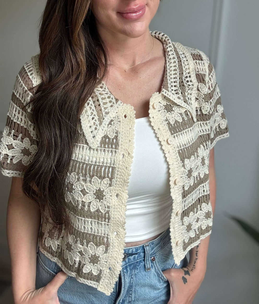 Woman wearing Blossom Top, an elegant floral button-up with crochet detailing, perfect for Christian women's fashion.
