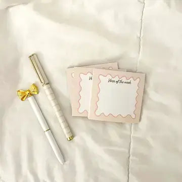 Bow Verse Sticky Notes with a gold-accented pen on a soft white surface, ideal for daily inspirational reminders.