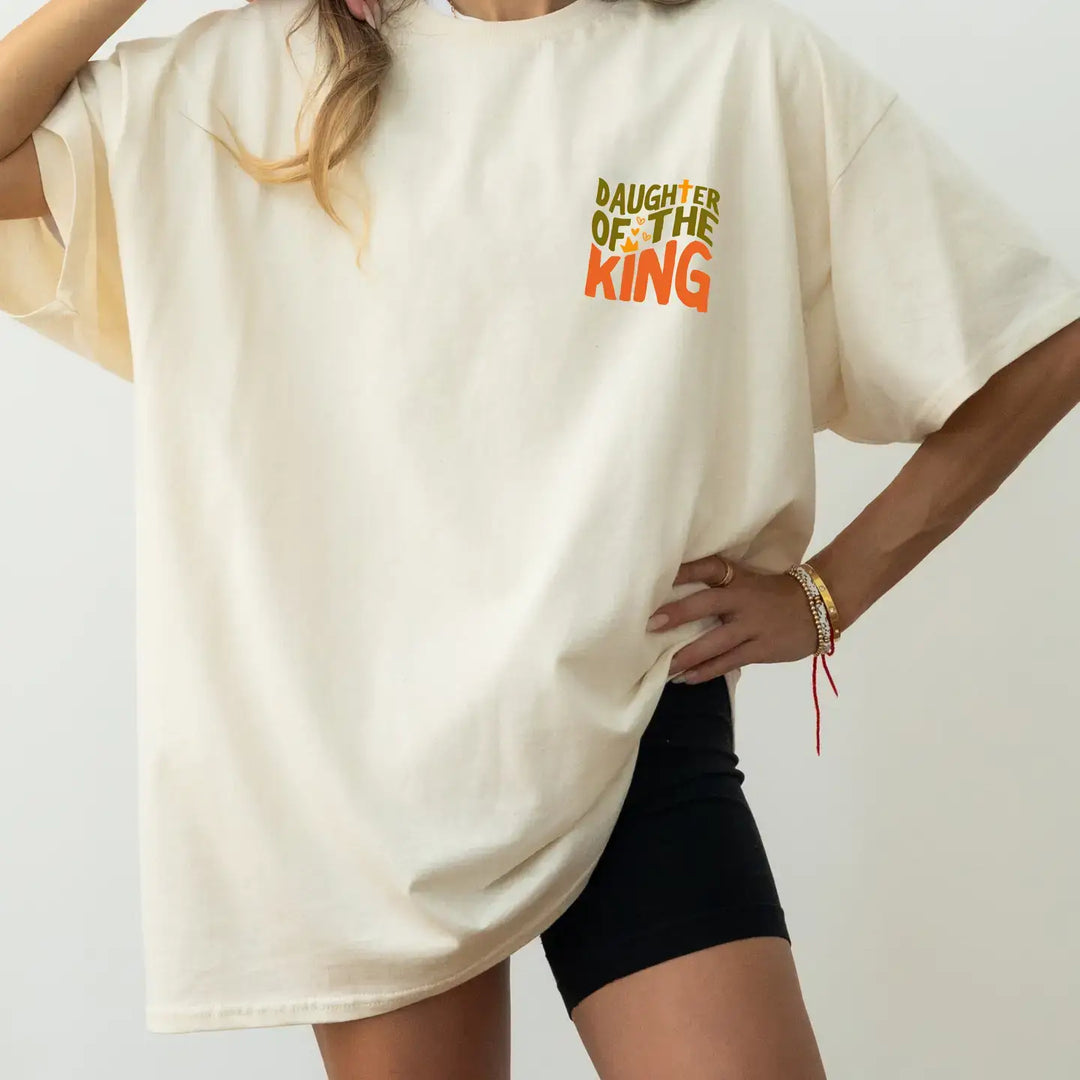 Called Oversized Tee featuring 'Daughter of the King' in vibrant design, perfect for expressing faith and identity.