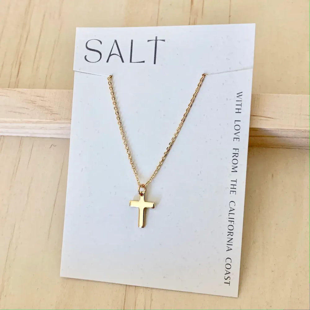 Simple Faith Necklace featuring a dainty gold cross on a card labeled 'SALT' from California coast.