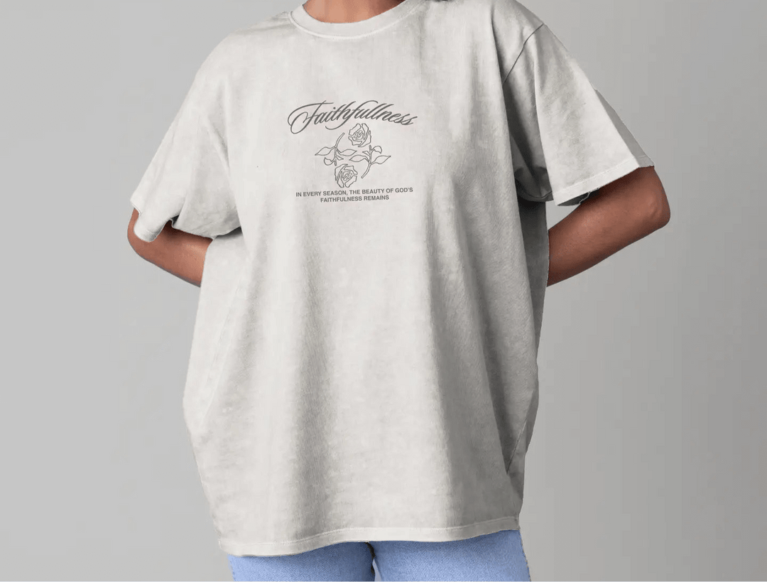 Model wearing Faithfulness Tee in heavyweight cotton, featuring stylish graphic and relaxed fit design.