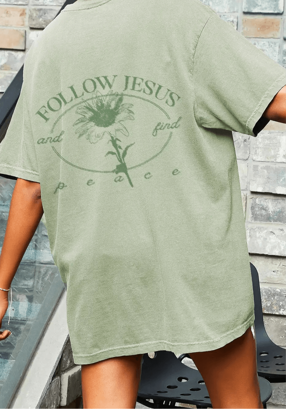 Casual heavyweight cotton tee with 'Follow Jesus and find peace' graphic on back, featuring a relaxed fit.