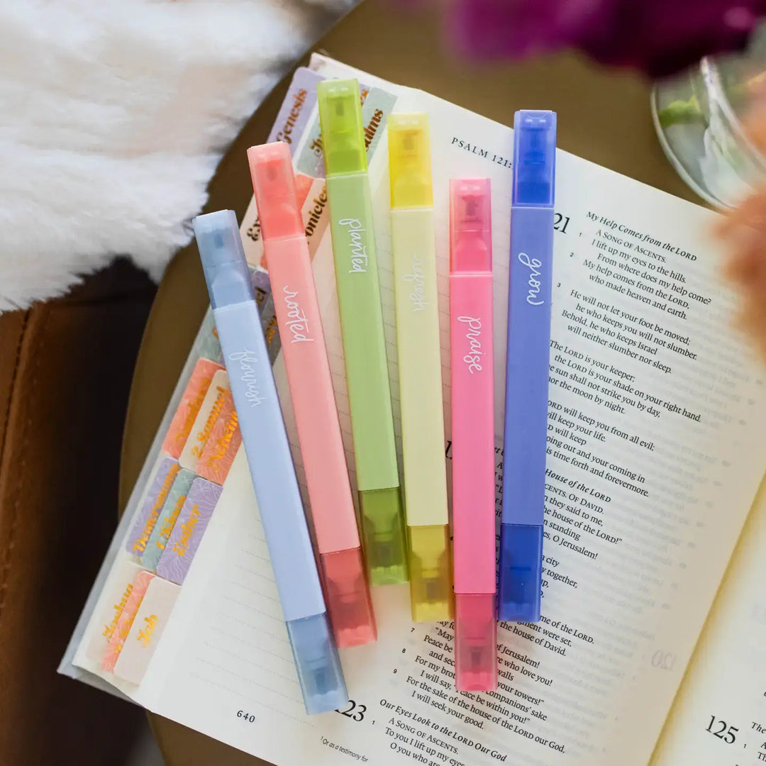 Garden Highlighters arranged on an open Bible, showcasing six vibrant colors for creative studying.