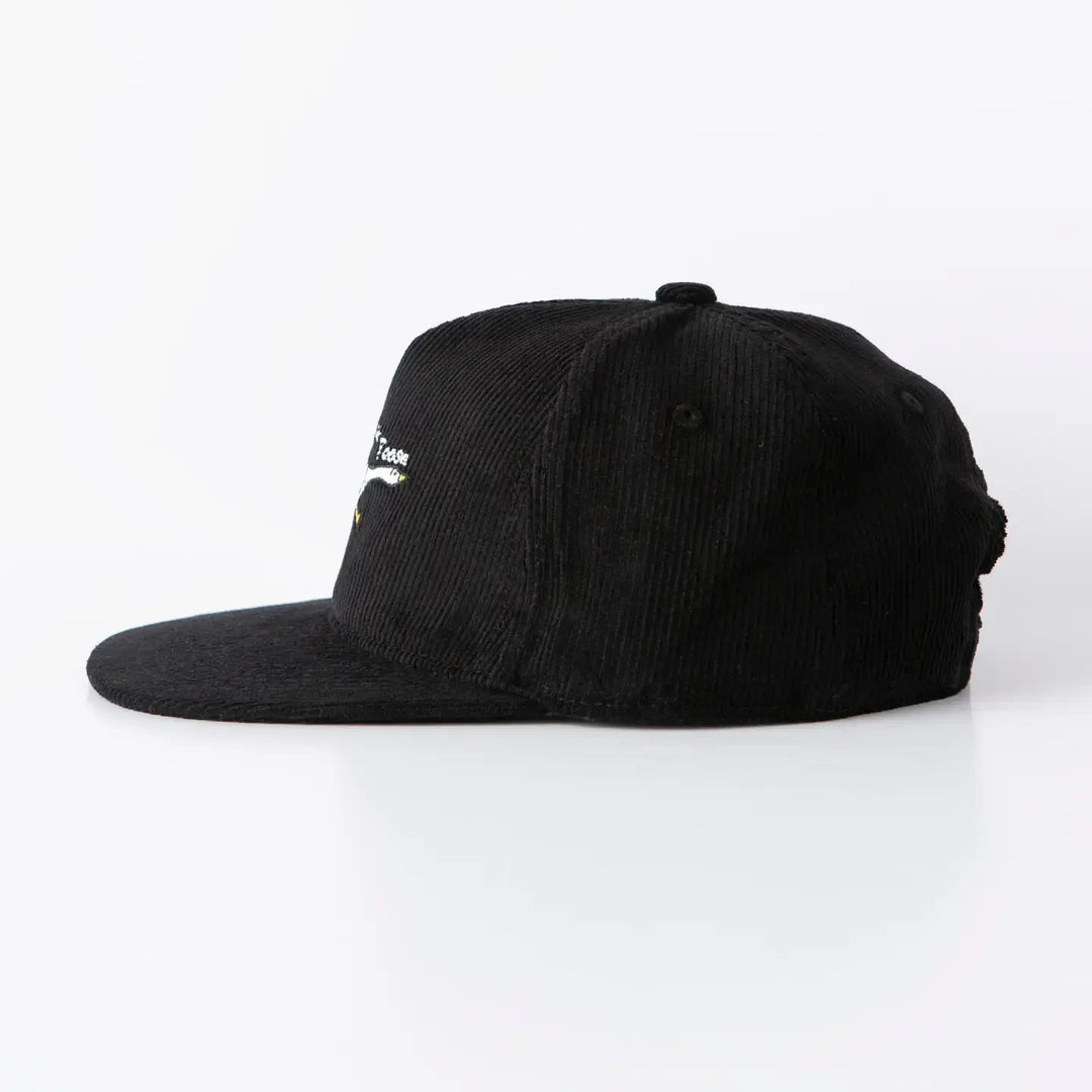 Side view of God's Silliest Goose black corduroy hat with playful embroidery.