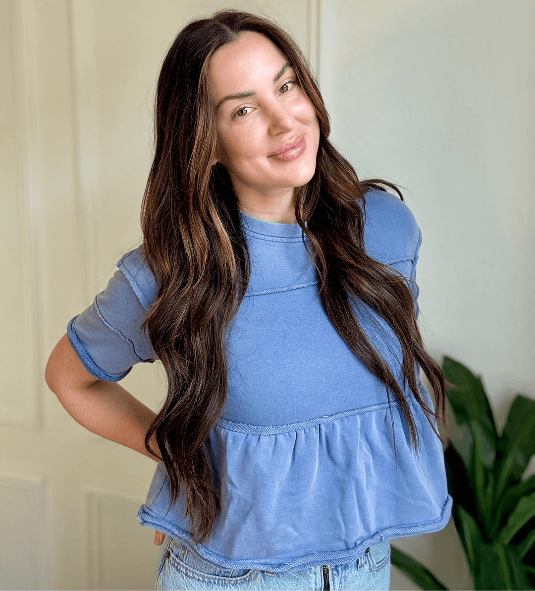Joyous Tiered Blouse in soft denim blue, featuring cascading ruffles for a feminine silhouette, perfect for Christian women's fashion.