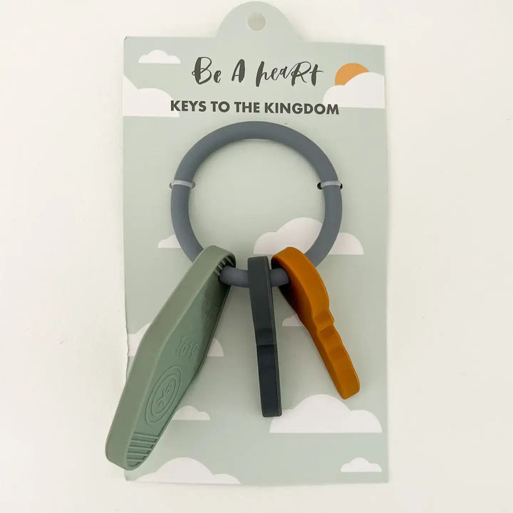 Keys to the Kingdom silicone teether featuring colorful keys on a gray ring, promoting faith for babies.