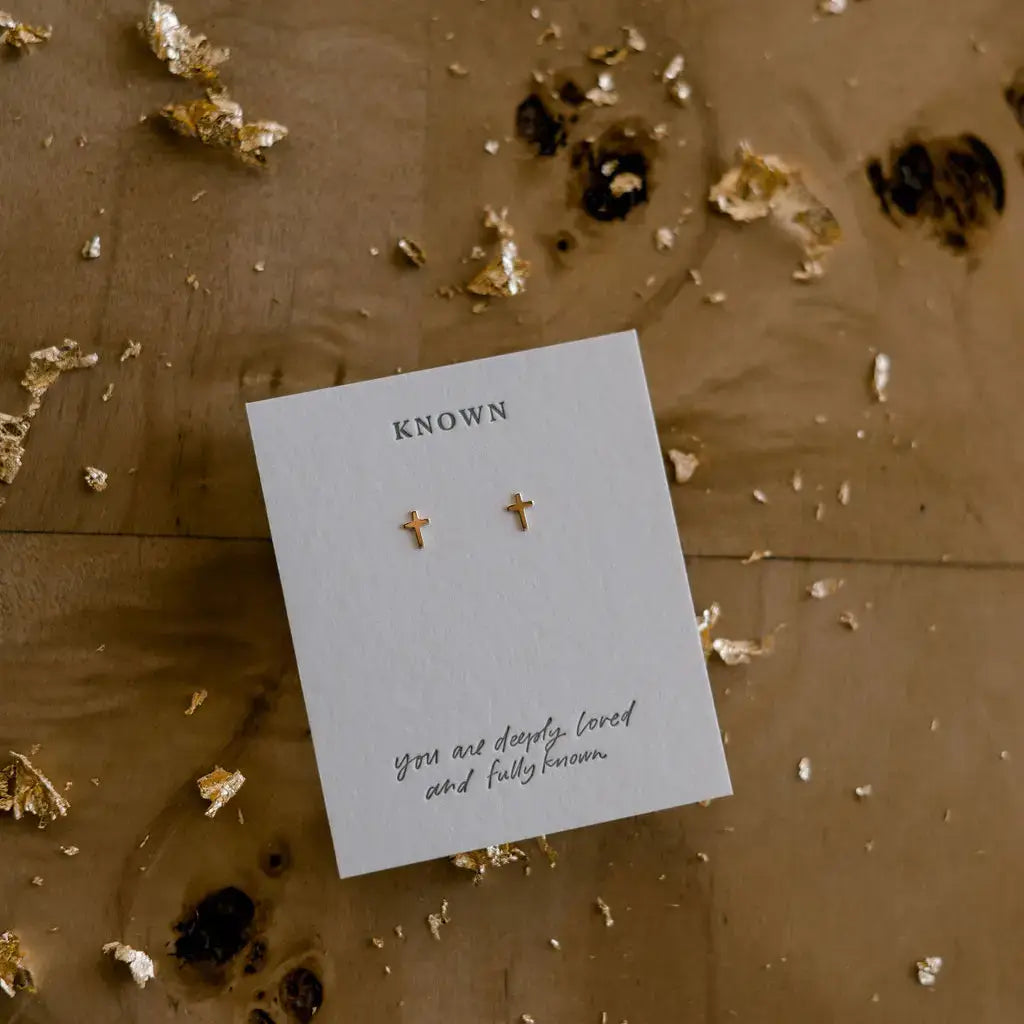 Known Stud Earrings in 14kt gold with cross design, symbolizing unconditional love by Jesus.