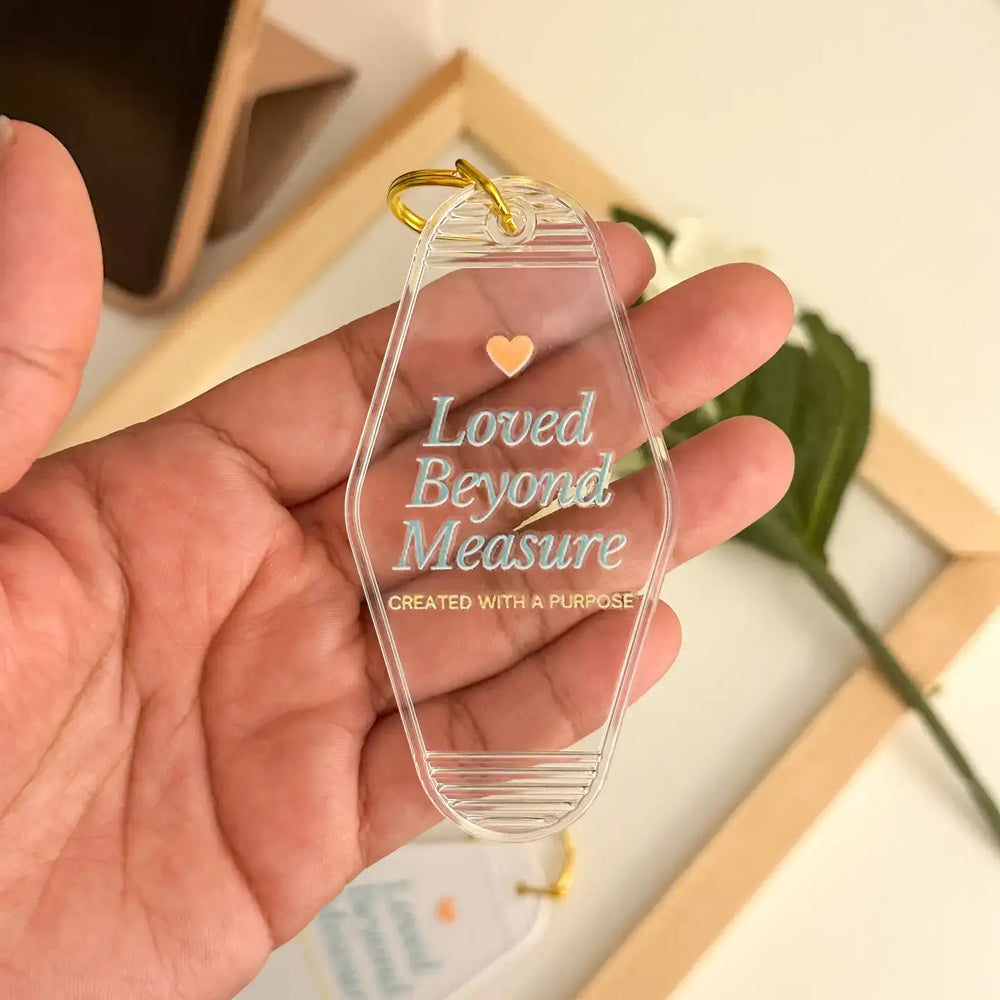 Acrylic keychain displaying the phrase 'Loved Beyond Measure' as a reminder of worth and purpose.