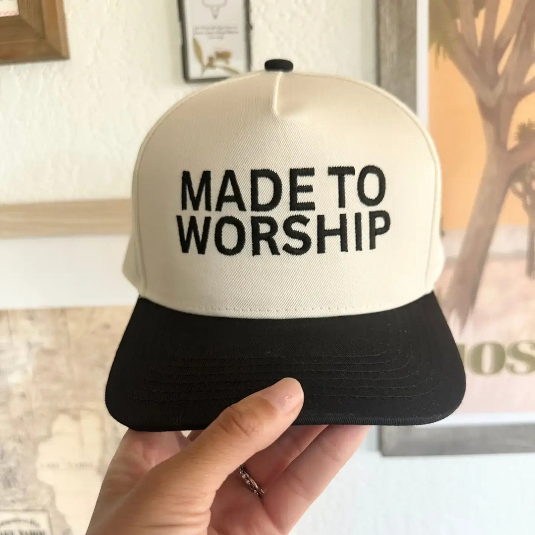 Stylish Made to Worship embroidered hat in black and cream, showcasing a 5-panel structured design and adjustable snap closure.