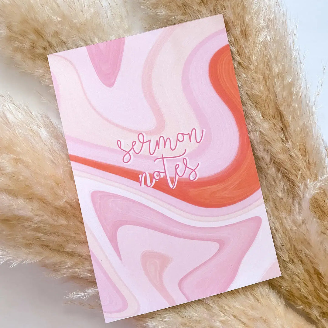 Marbled Sermon Notes Journal with pink swirls on the cover, ideal for capturing notes and reflections during church services.