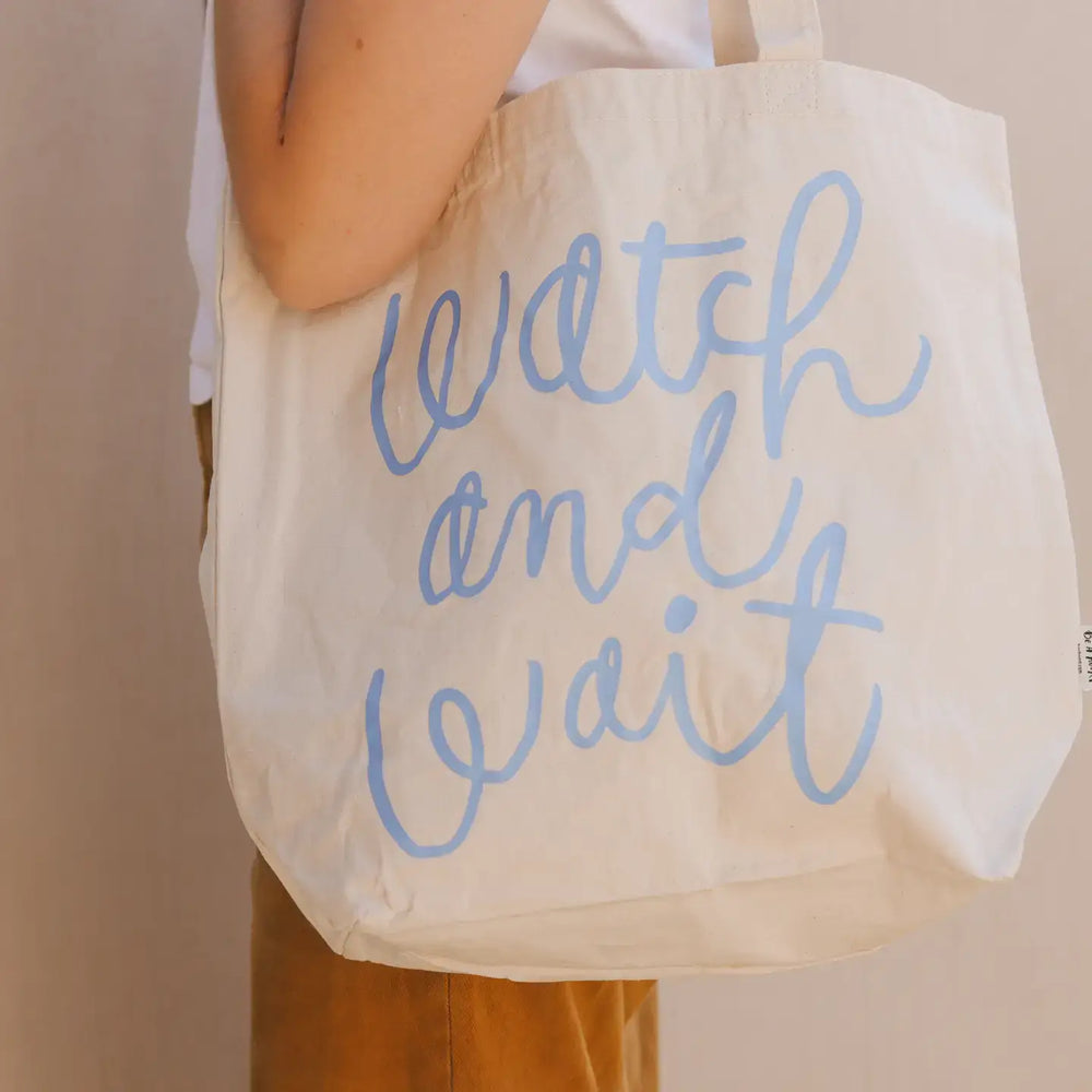 Watch and Wait Tote Bag showcasing stylish design with inspiring text, perfect for everyday use and organization.