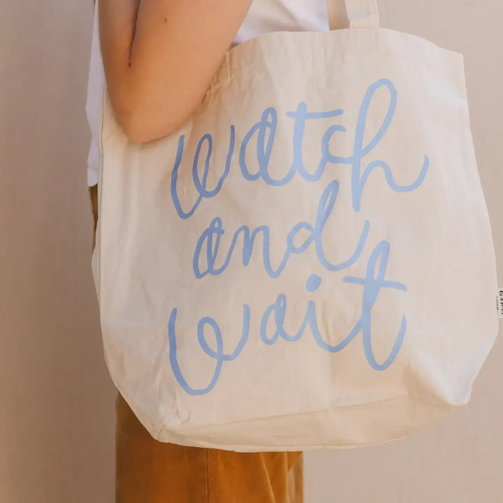 Watch and Wait Tote Bag showcasing stylish design with inspiring text, perfect for everyday use and organization.