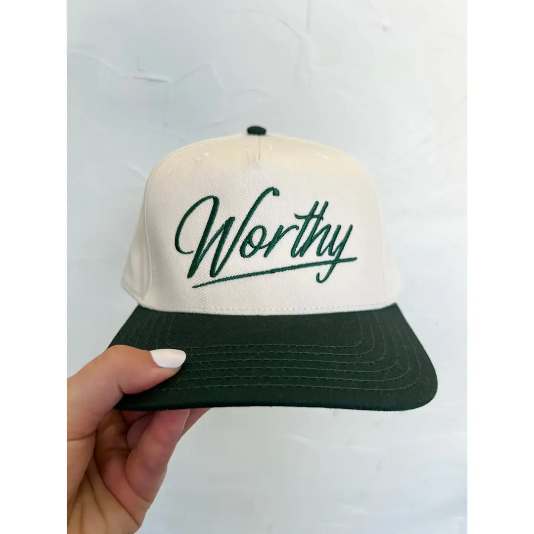 Worthy baseball cap in cream and green, featuring the embroidered word 'Worthy' for faith-inspired style.